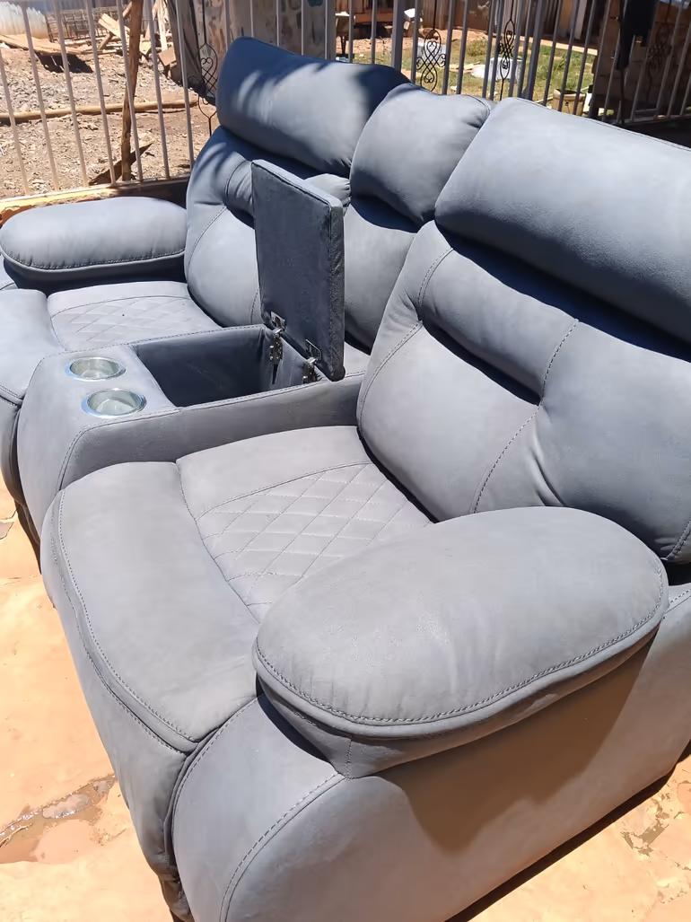 Grey recliner sofa set freshly cleaned in an outdoor drying area in Nairobi
